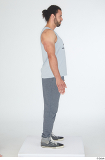 Simeon dressed grey joggers grey sneakers grey tank top sports…